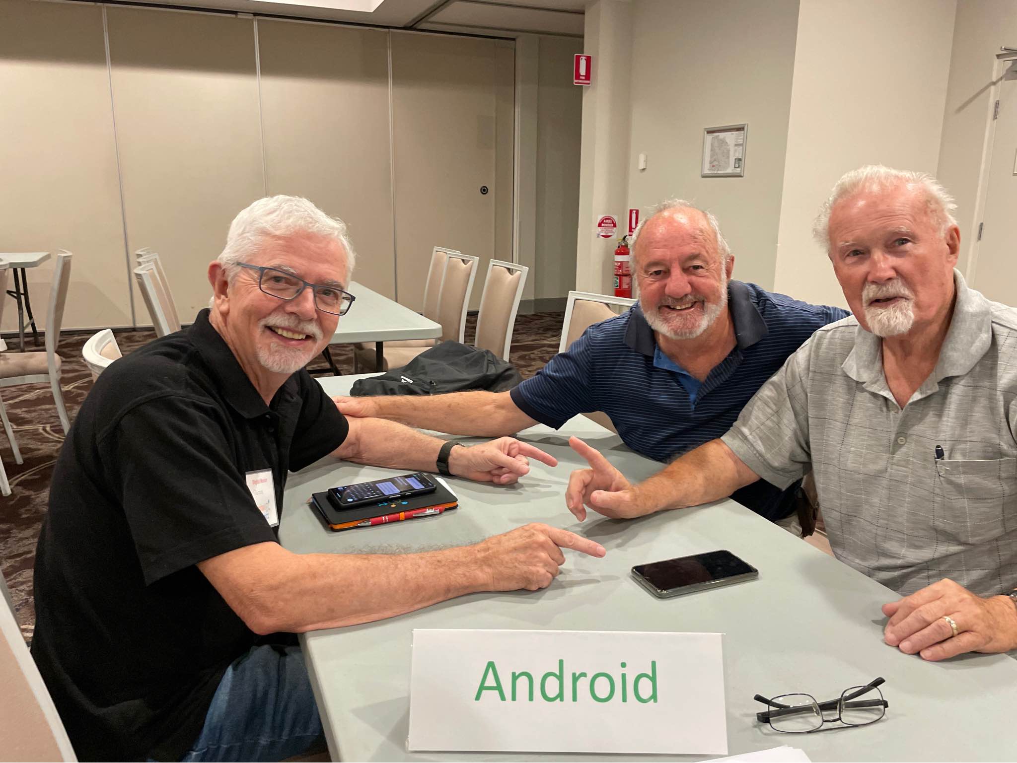 Digital Mentor assisting men with their android smartphone